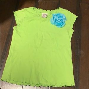 green top with blue flower